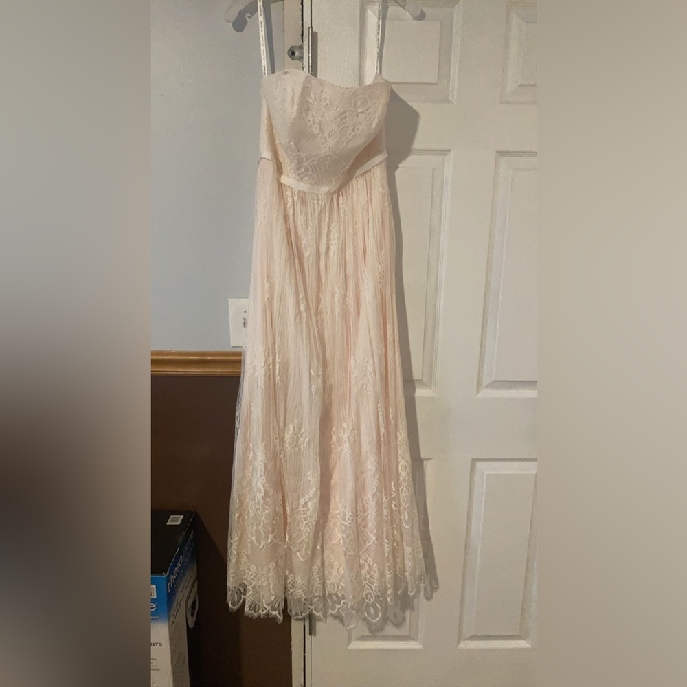 Gorgeous lace blush floor length gown. Strapless sleeves